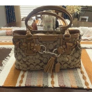 Coach classic fabric cc design. Tan leather trim.